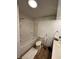 Bathroom with a bathtub, shower, toilet, and a sink with towel rack at 28 Cambridge Ct, Anderson, IN 46012
