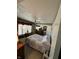 Bedroom with floral wallpaper, a ceiling fan, and a window with blinds at 28 Cambridge Ct, Anderson, IN 46012