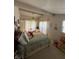 Bedroom with a ceiling fan, decor, and a window with blinds at 28 Cambridge Ct, Anderson, IN 46012