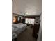Bedroom with floral wallpaper, a ceiling fan, and a window with blinds at 28 Cambridge Ct, Anderson, IN 46012