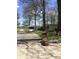 Charming property featuring a well-manicured front yard with vibrant spring flowers and large, mature trees at 28 Cambridge Ct, Anderson, IN 46012