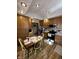 The kitchen features wooden cabinets, an eat-in nook, and modern appliances at 28 Cambridge Ct, Anderson, IN 46012