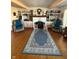 Charming living room with hardwood floors, a fireplace, and built-in bookshelves at 28 Cambridge Ct, Anderson, IN 46012