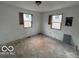 Unfinished room awaiting renovation with a blank walls and boarded windows at 2912 N Gladstone Ave, Indianapolis, IN 46218