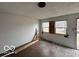 Sunlit living room with boarded windows, presenting an opportunity for renovation at 2912 N Gladstone Ave, Indianapolis, IN 46218