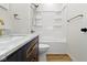Bathroom with a white shower/tub combo and updated vanity with marble countertop at 35 N Keystone Ave, Indianapolis, IN 46201