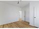 This bedroom has wood-look flooring and a modern ceiling fan with a light at 35 N Keystone Ave, Indianapolis, IN 46201