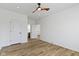 A bright bedroom with wood-look floors offers a ceiling fan and recessed lighting at 35 N Keystone Ave, Indianapolis, IN 46201