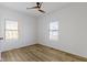 This bedroom has natural light, wood-look flooring and modern ceiling fan with light at 35 N Keystone Ave, Indianapolis, IN 46201