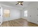 Clean bedroom with natural light and wood-look floors with ceiling fan at 35 N Keystone Ave, Indianapolis, IN 46201