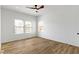 Bright bedroom with hardwood floors and multiple windows allowing ample natural light at 35 N Keystone Ave, Indianapolis, IN 46201