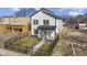 New construction home with a black metal fence and landscaping at 35 N Keystone Ave, Indianapolis, IN 46201