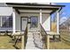 A closer view of the entry and porch area including landscaping at 35 N Keystone Ave, Indianapolis, IN 46201