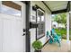 Inviting front porch with comfortable chairs and lush greenery at 35 N Keystone Ave, Indianapolis, IN 46201