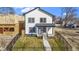 Charming two-story home with landscaped yard, fenced in yard, and a welcoming front porch at 35 N Keystone Ave, Indianapolis, IN 46201