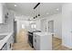 Modern kitchen with stainless steel appliances and an open floor plan at 35 N Keystone Ave, Indianapolis, IN 46201
