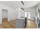 Modern kitchen featuring an island with sleek countertops and stainless steel appliances at 35 N Keystone Ave, Indianapolis, IN 46201
