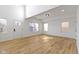Bright living room with hardwood floors, large windows, and high ceilings for natural light at 35 N Keystone Ave, Indianapolis, IN 46201