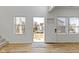 Bright, open-concept living room featuring hardwood floors, plenty of natural light, and a contemporary design at 35 N Keystone Ave, Indianapolis, IN 46201