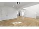 Open concept living room featuring hardwood floors, recessed lighting, and high ceilings at 35 N Keystone Ave, Indianapolis, IN 46201