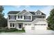 Charming two-story home featuring a two car garage, manicured lawn and professional landscaping at 3707 Thomas Jefferson St, Westfield, IN 46074