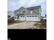 Newly constructed two-story home featuring a two car garage and horizontal siding at 3707 Thomas Jefferson St, Westfield, IN 46074