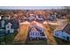 Aerial view of the back exterior with a patio overlooking the waterfront at 4042 Eagle Cove East Dr, Indianapolis, IN 46254