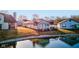 Aerial view of the back exterior with a patio overlooking the waterfront at 4042 Eagle Cove East Dr, Indianapolis, IN 46254