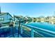 Scenic view of the backyard with water views from the wooden deck and white railing at 4042 Eagle Cove East Dr, Indianapolis, IN 46254