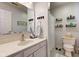 Bathroom with a stylish vanity, mirror, and white wall accents at 4042 Eagle Cove East Dr, Indianapolis, IN 46254