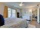 Bedroom featuring a ceiling fan, hardwood floors, and ample natural light from the window at 4042 Eagle Cove East Dr, Indianapolis, IN 46254