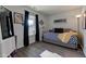 Bright bedroom featuring hardwood floors, a modern daybed, and stylish decor at 4042 Eagle Cove East Dr, Indianapolis, IN 46254