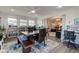 Spacious dining room with large bookcase, modern table with seating, and decor at 4042 Eagle Cove East Dr, Indianapolis, IN 46254
