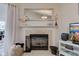 Close-up of the fireplace with white mantel, decorative mirror, and hearth at 4042 Eagle Cove East Dr, Indianapolis, IN 46254
