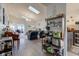 Open-concept living room with skylights, fireplace, and modern decor at 4042 Eagle Cove East Dr, Indianapolis, IN 46254