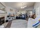 Open concept living room with fireplace, vaulted ceiling, and view of the kitchen at 4042 Eagle Cove East Dr, Indianapolis, IN 46254