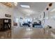 An open living room area with a granite countertop island, fireplace, and ample lighting at 4042 Eagle Cove East Dr, Indianapolis, IN 46254