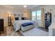Cozy main bedroom with hardwood floors, a ceiling fan, and a window view at 4042 Eagle Cove East Dr, Indianapolis, IN 46254