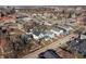 An aerial view of a residential neighborhood with diverse architectural styles and tree-lined streets at 418 Sanders St, Indianapolis, IN 46225