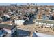An aerial view showcasing a city neighborhood with a mix of houses and tree-lined streets at 418 Sanders St, Indianapolis, IN 46225