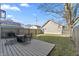 Private backyard with a wooden deck, perfect for outdoor dining and relaxation at 418 Sanders St, Indianapolis, IN 46225
