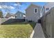 A well-manicured backyard with a patio, lawn, and privacy fence at 418 Sanders St, Indianapolis, IN 46225