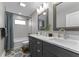 This bathroom boasts a double vanity with modern fixtures, and a stylish shower/bath combo at 418 Sanders St, Indianapolis, IN 46225