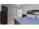 Comfortable bedroom with a plush bed, soft lighting, and ample closet space for storage at 418 Sanders St, Indianapolis, IN 46225