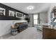 Charming Bedroom with a dark accent wall, whimsical decor, and a comfortable seating area at 418 Sanders St, Indianapolis, IN 46225