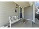 Cozy front porch with a bench, stylish light fixture, and inviting decor at 418 Sanders St, Indianapolis, IN 46225
