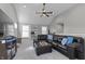 Cozy living room with a large sectional couch, vaulted ceilings, and a ceiling fan at 418 Sanders St, Indianapolis, IN 46225