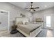 Spacious main bedroom with a ceiling fan, large bed, and ensuite bathroom access at 418 Sanders St, Indianapolis, IN 46225