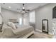 Bright main bedroom featuring neutral tones, ceiling fan, and stylish decor at 418 Sanders St, Indianapolis, IN 46225