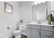 This bathroom includes white cabinets, a white countertop, and an oval toilet at 4544 W Rising Sun Dr, New Palestine, IN 46163